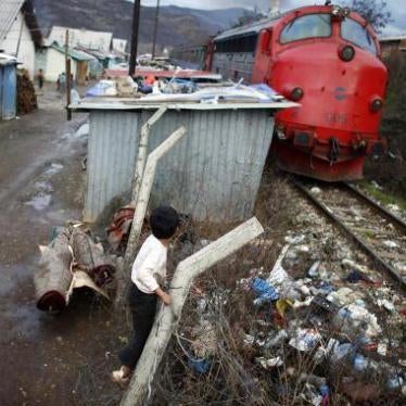 Roma children play in the Cesmin Lug refugee camp in Mitrovica city, northern Kosovo. Cesmin Lug is one of several camps that the UN established in what was known to be a heavily contaminated area near a defunct lead mine. December 12, 2007.