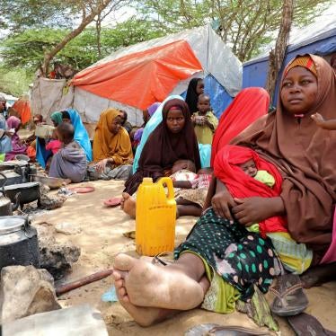Somali families, displaced after fleeing the Lower Shabelle region amid an uptick in US airstrikes, rest at an internally displaced persons camp near Mogadishu, Somalia, March 12, 2020. © March 12, 2020 REUTERS/Feisal Omar.