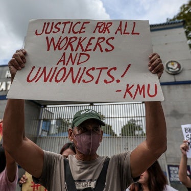 Workers hold a rally outside police headquarters in Quezon City, Philippines, in response to the brutal killing the previous week of labor organizer Jude Thaddeus Fernandez from Kilusang Mayo Uno, October 5, 2023.